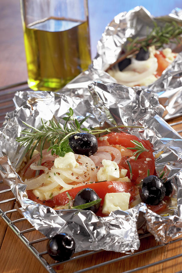 Grilled Tomatoes, Sheeps Cheese, Onions And Olives In Aluminium Foul Photograph by Teubner Foodfoto