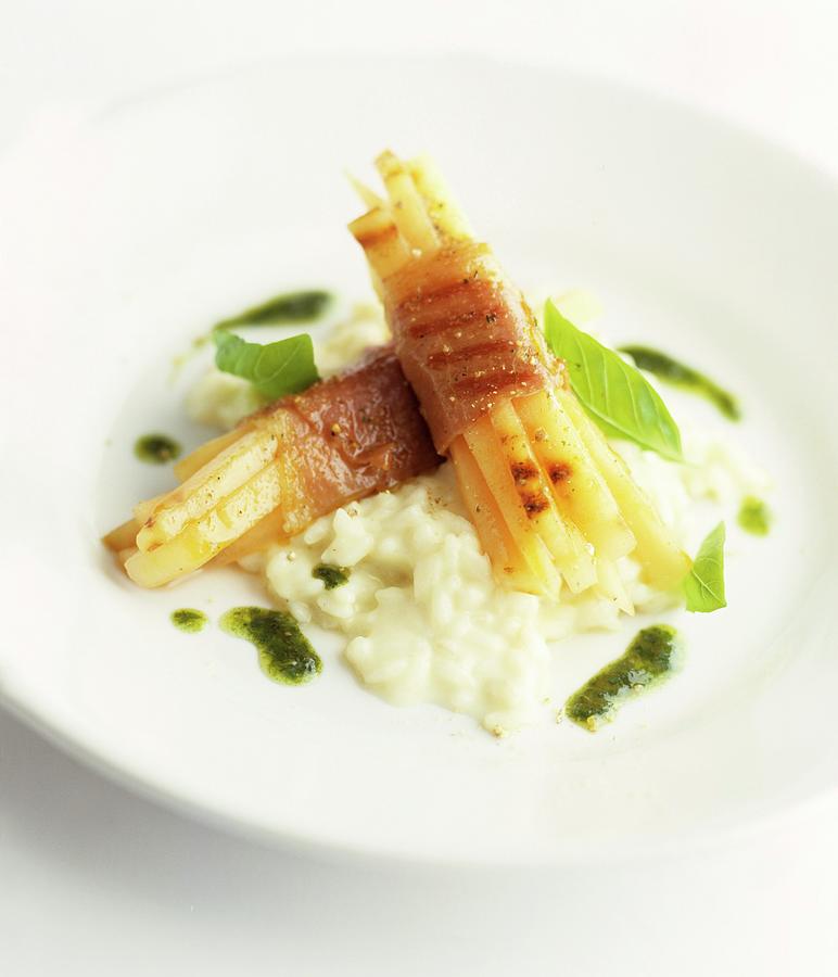 Grilled White Asparagus Wrapped In Ham, On Risotto Photograph by Michael Wissing
