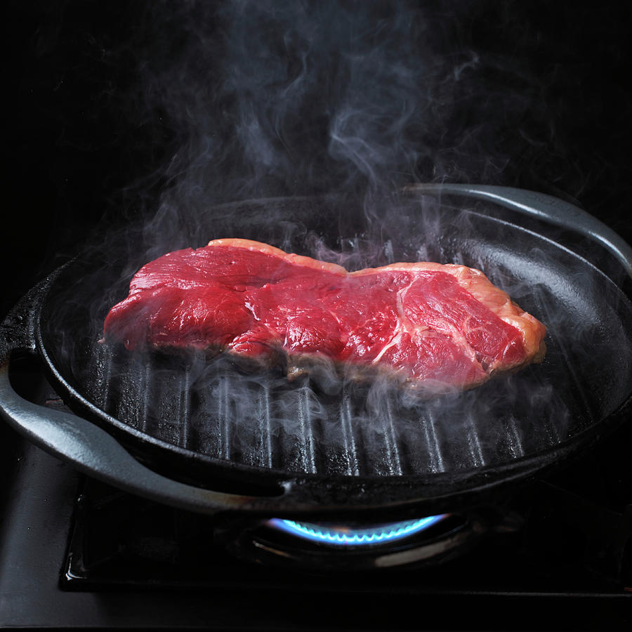 Grilling Steak Photograph by William Reavell