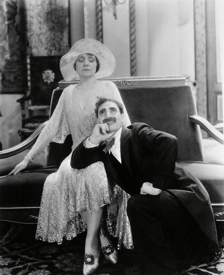 GROUCHO MARX and MARGARET DUMONT in THE COCOANUTS -1929-. Photograph by Album