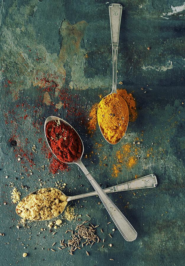 Ground Paprika, Turmeric, Cumin And Fennel Seeds Photograph by Charlotte Kibbles