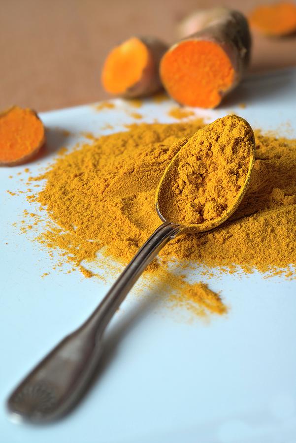 Ground Turmeric On A Silver Spoon Photograph by Dr. Martin Baumgrtner