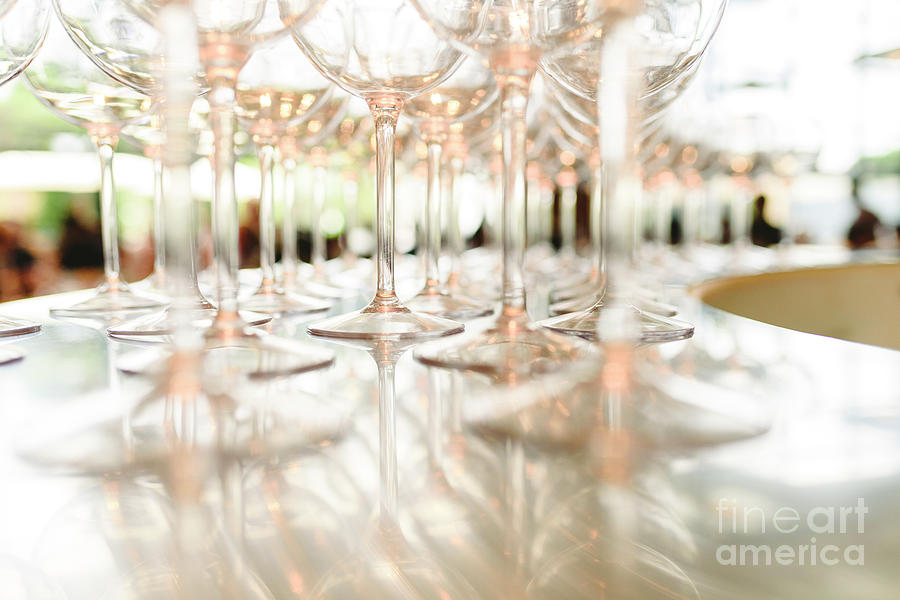 Group of empty transparent glasses ready for a party in a bar. Photograph by Joaquin Corbalan