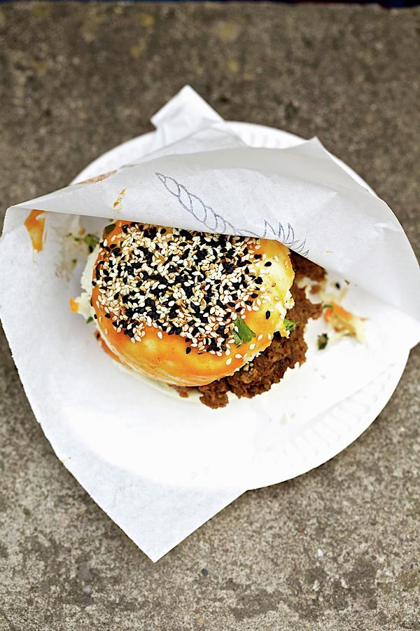 Gua Bao Burger With Sesame Seeds On A Disposable Plate oriental Street Food Photograph by Sophia Schillik