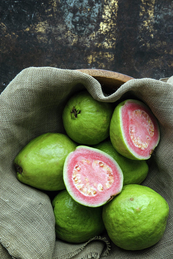 Guavas, Whole And Halved, On A Linen Cloth Photograph by Max D. Photography