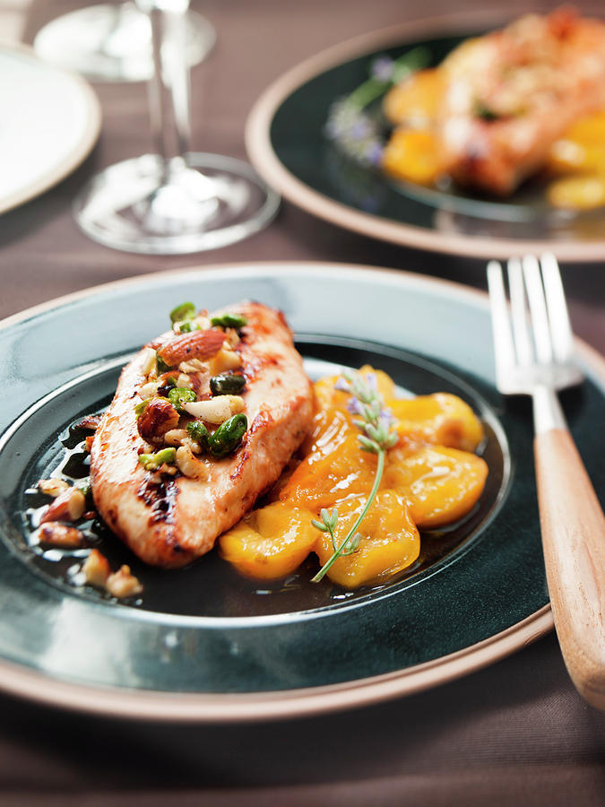 Guinea-fowl Fillet Garnished With Dried Fruit And Stewed Apricots Photograph by Nicolas Edwige
