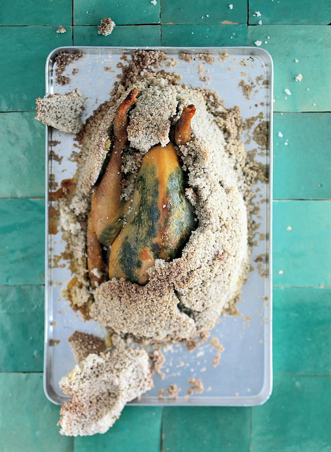 Still Life Photograph - Guinea Fowl In Salt Crust Served On Tray by Jalag / Wolfgang Schardt