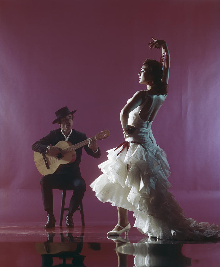 Guitarist Playing Guitar And Woman Photograph by Tom Kelley Archive