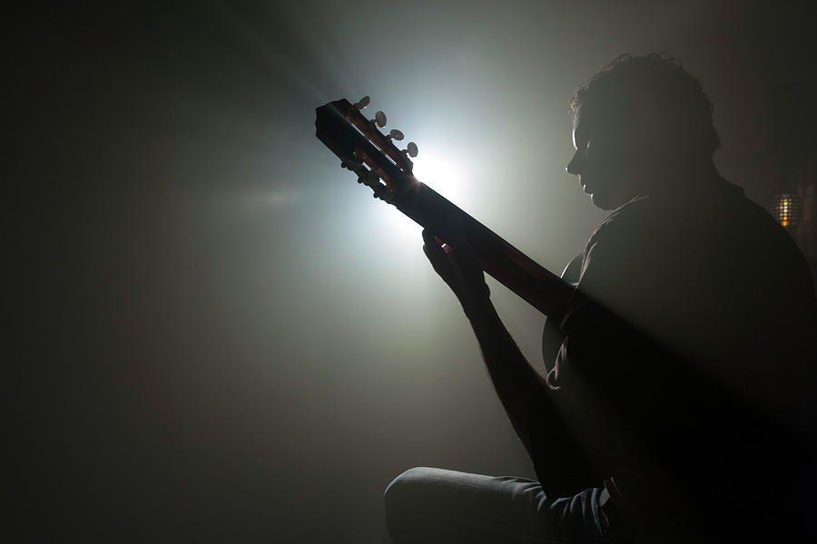 Guitarist Playing Instrument On Stage Photograph by Tooga
