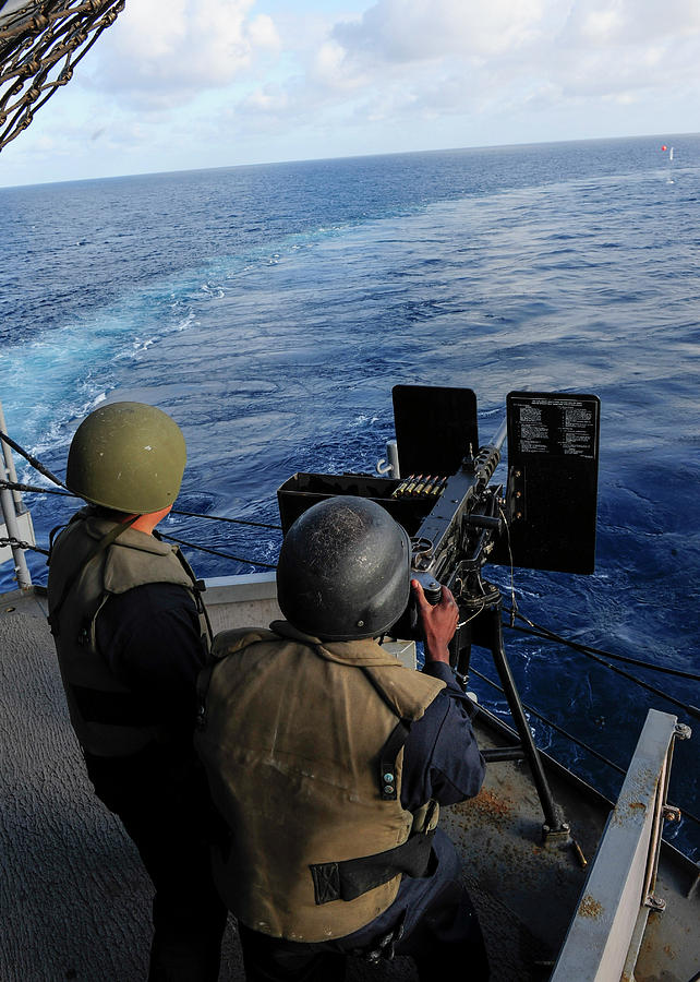 Gunners Mate Seaman Fires A .50 Caliber Photograph by Stocktrek Images