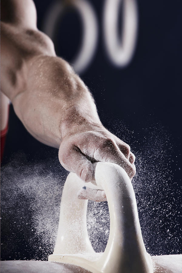 Gymnast Gripping To A Pommel Horse Photograph by Oliver Rossi
