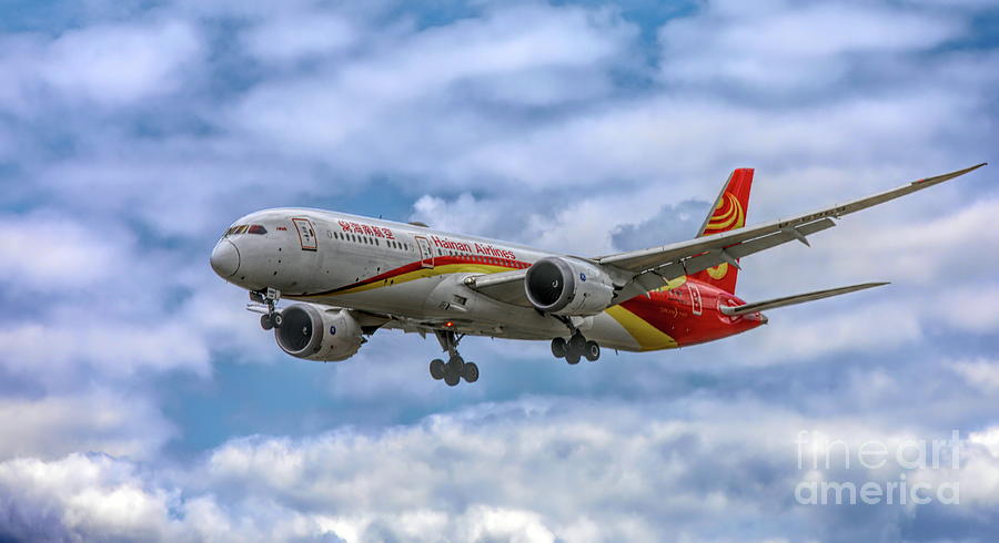 Hainan Airlines in Flight  Photograph by Chuck Kuhn