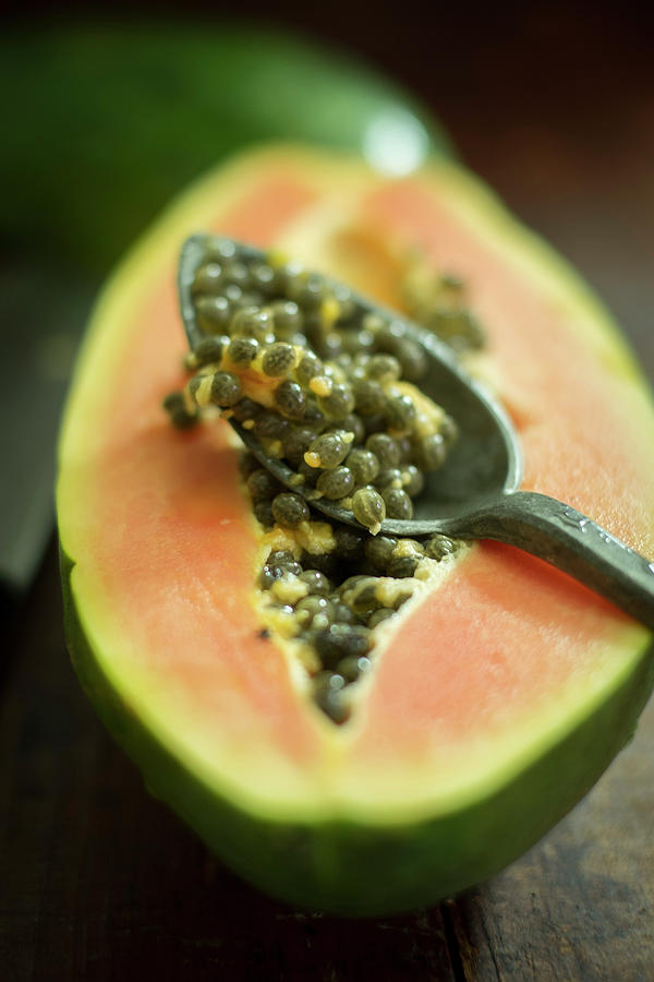 Half A Papaya With Seeds close-up Photograph by Eising Studio