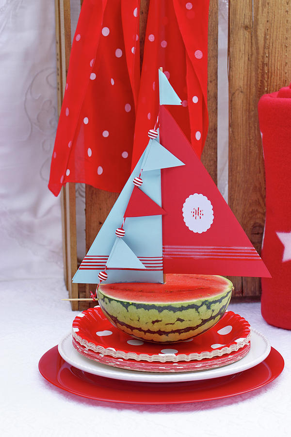 Half A Watermelon Decorated With A Paper Sail Photograph by Angelica Linnhoff