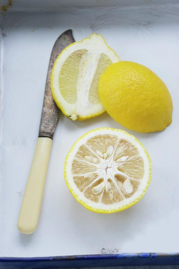 Half A Yuzu And A Halved Lemon Photograph by Martina Schindler