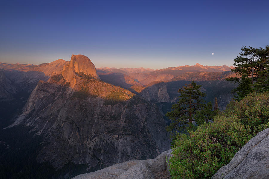 Half Dome In Yosemite National Park Lit Up In Summer Sunset, Moon On The Horizon, Usa Photograph by Bastian Linder