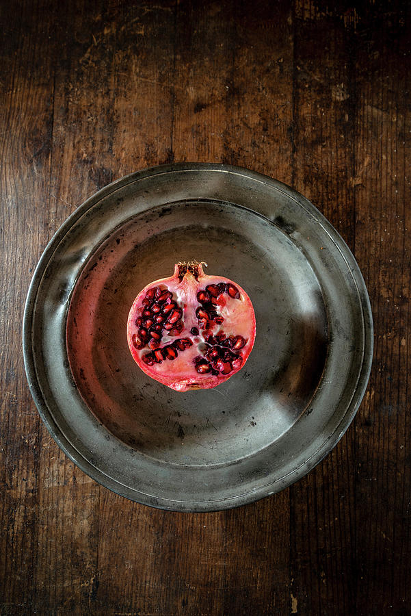 Half Pomegranate On A Metal Plate Photograph by Nitin Kapoor