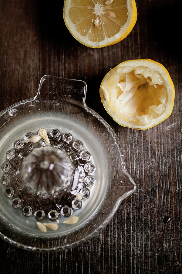Halfs Of Squeezed Lemon, Lemon Squeezer Photograph by Westend61
