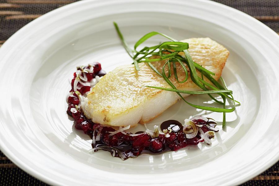 Halibut With A Seed Oil And Lingonberry Sauce Photograph by Herbert Lehmann