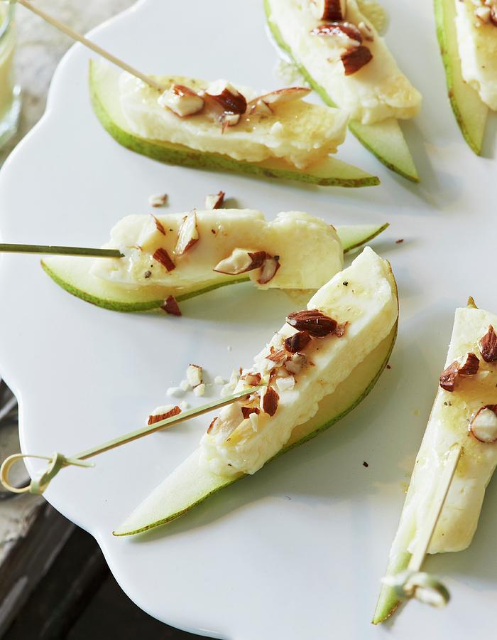 Halloumi And Pear Skewers With Almonds Photograph by Hannah Kompanik