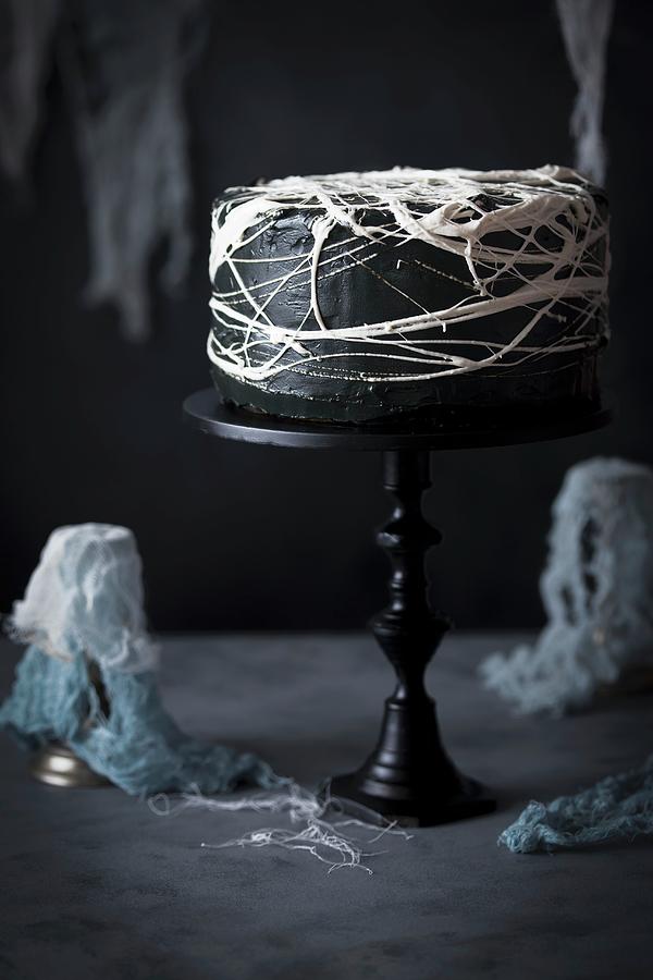 Halloween Cake With Black Frosting And Marshmallow Spiders Web Photograph by Malgorzata Laniak