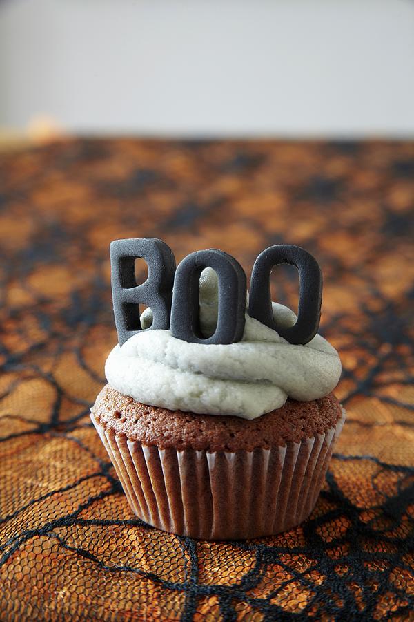 Halloween Cupcakes Topped With Buttercream Icing And Decorative Letters Photograph by Simon Scarboro