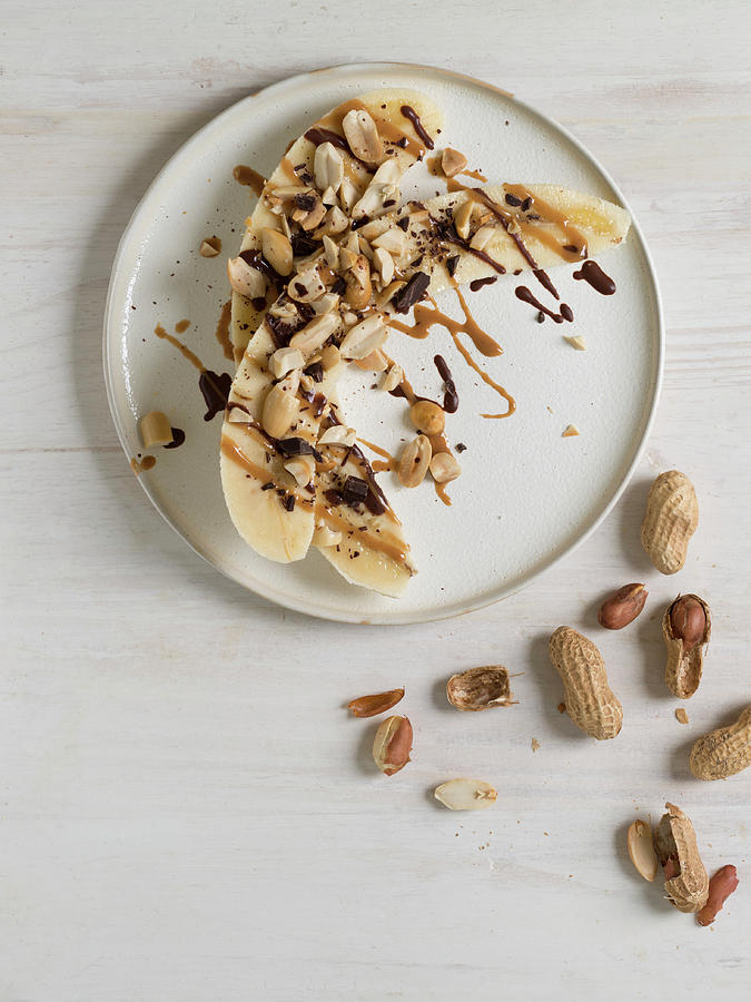 Halved Bananas With Peanuts, Peanut Butter And Chocolate Photograph by Laurange