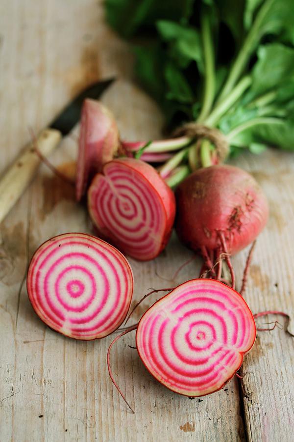Halved Beetroot On A Wooden Surface Photograph by Mariani, Carmen