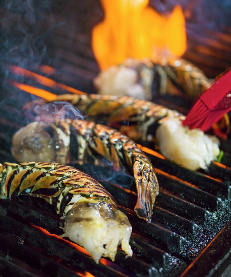 Halved Lobster Tails On A Barbecue Photograph by Don Crossland