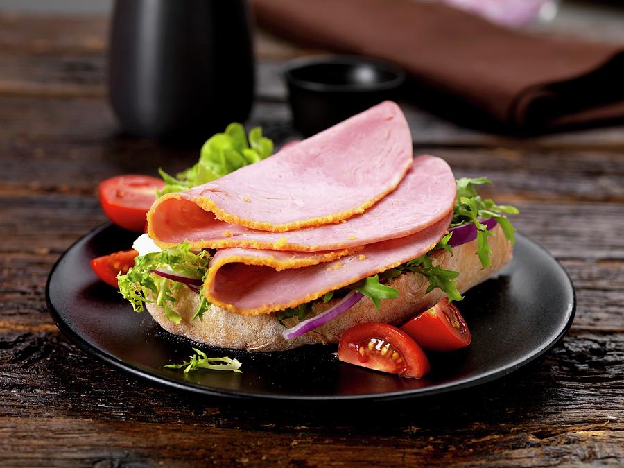 Ham And Lettuce On Ciabatta Bread Photograph by Robert Morris