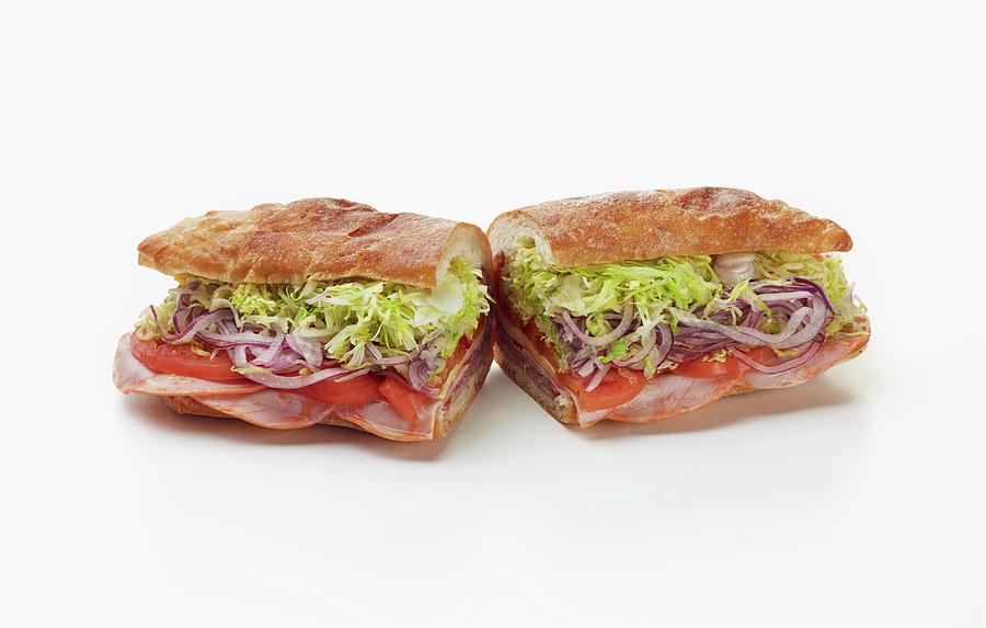 Ham, Tomatoes, Red Onions And Lettuce Sandwiche Photograph by Rene Comet