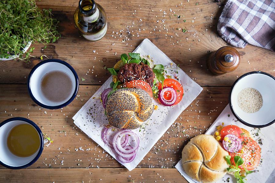 Hamburger With A Poppy Seed Bun, Fresh Tomatoes, Onion And Sesame Seeds Photograph by Natalia Mantur