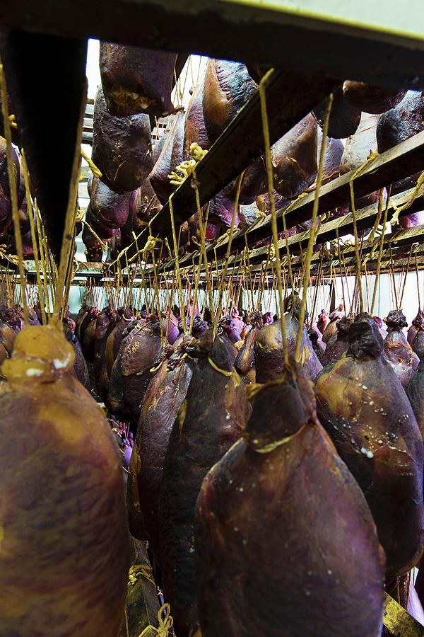 Hams Hanging Up To Dry Photograph by Nicolas Lemonnier