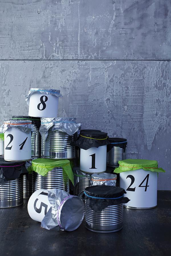 Hand-crafted Advent Calender Made From Tin Cans With Tissue Paper Lids Photograph by Bodo Mertoglu