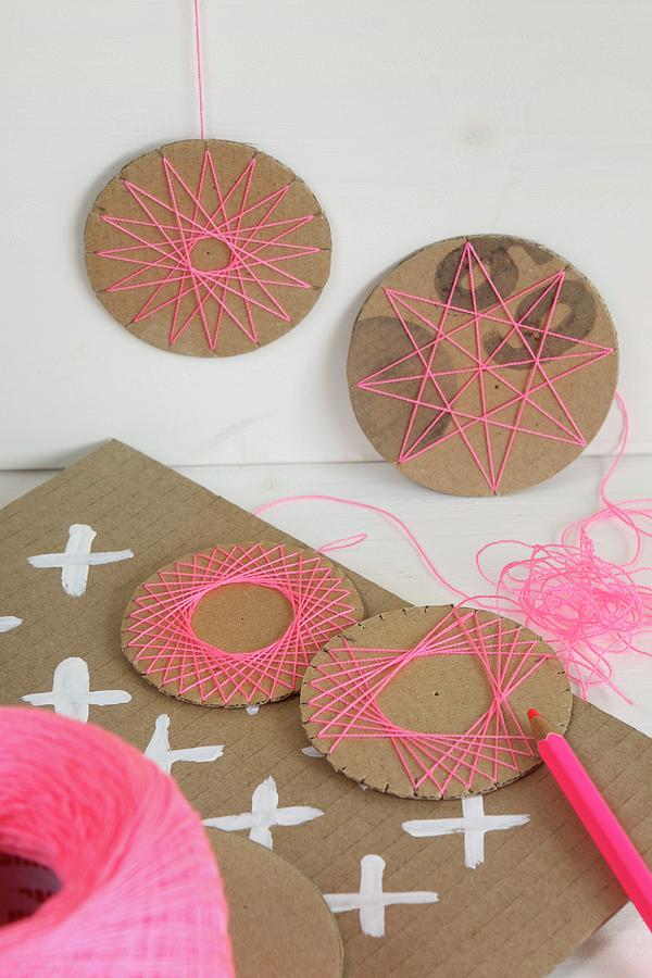 Hand-crafted, Circular Cardboard Decorations With Patterns Of Thread Photograph by Regina Hippel