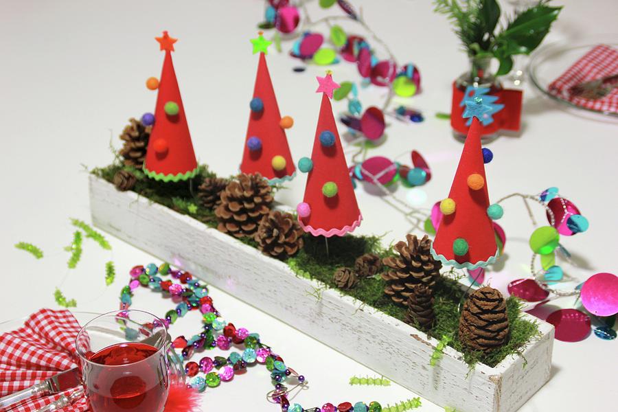 Hand-crafted, Festive Table Decoration With Garlands, Paper Christmas Trees & Pine Cones Photograph by Ruth Laing