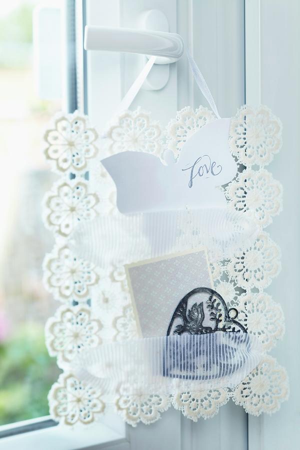 Hand-crafted Note Rack Made From Crocheted Doilies And Lace Ribbon Hanging On Door Handle Photograph by Franziska Taube