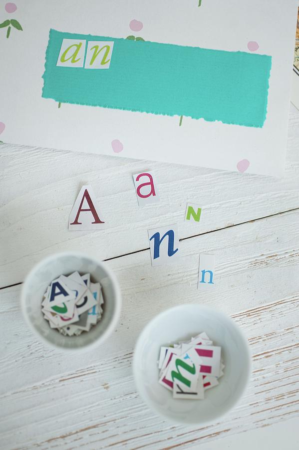 Hand-crafting Envelopes - Paper Letters On Wooden Surface And Sorted In White China Dishes Photograph by Studio27neun