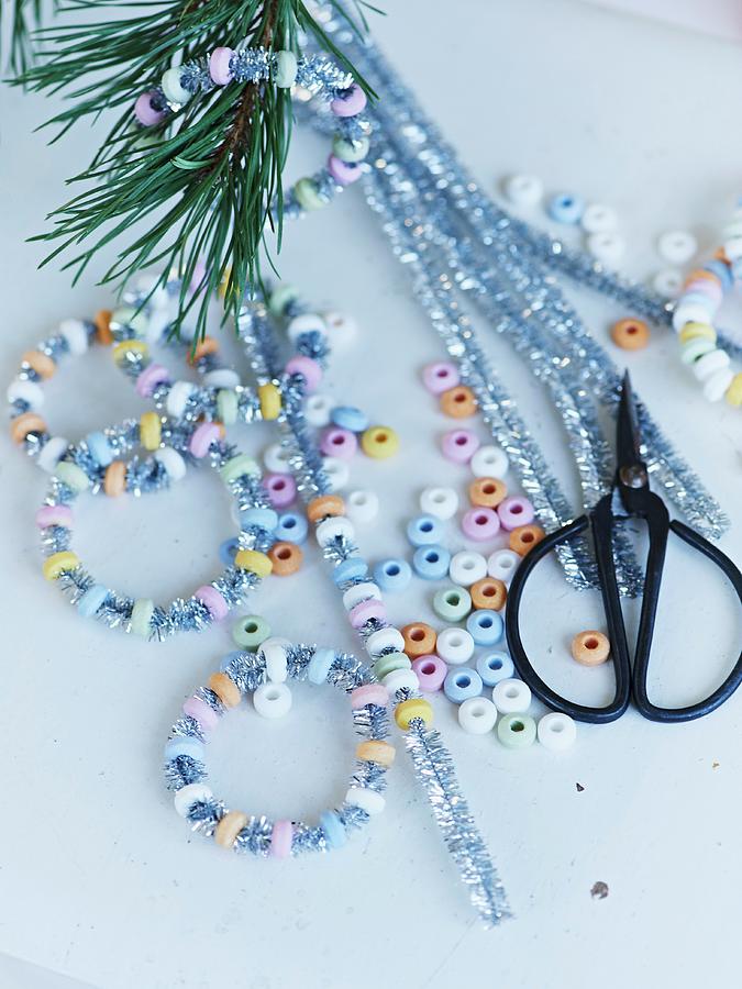 Hand-crafting Glittery, Sugar-bead Hoops For Christmas Tree Photograph by Hannah Kompanik