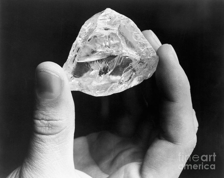 Hand Holding Light Of Peace Diamond Photograph by Bettmann