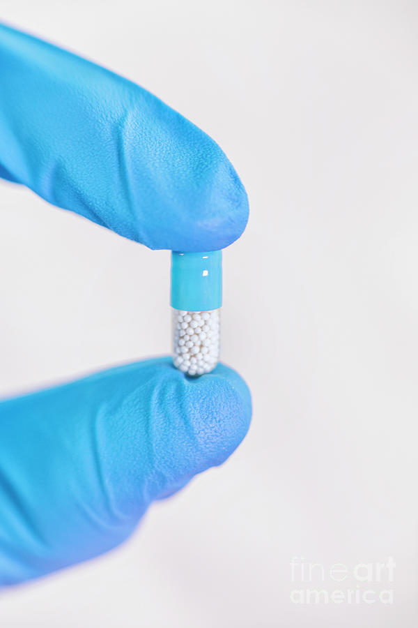 Hand Holding Pill Photograph by Microgen Images/science Photo Library