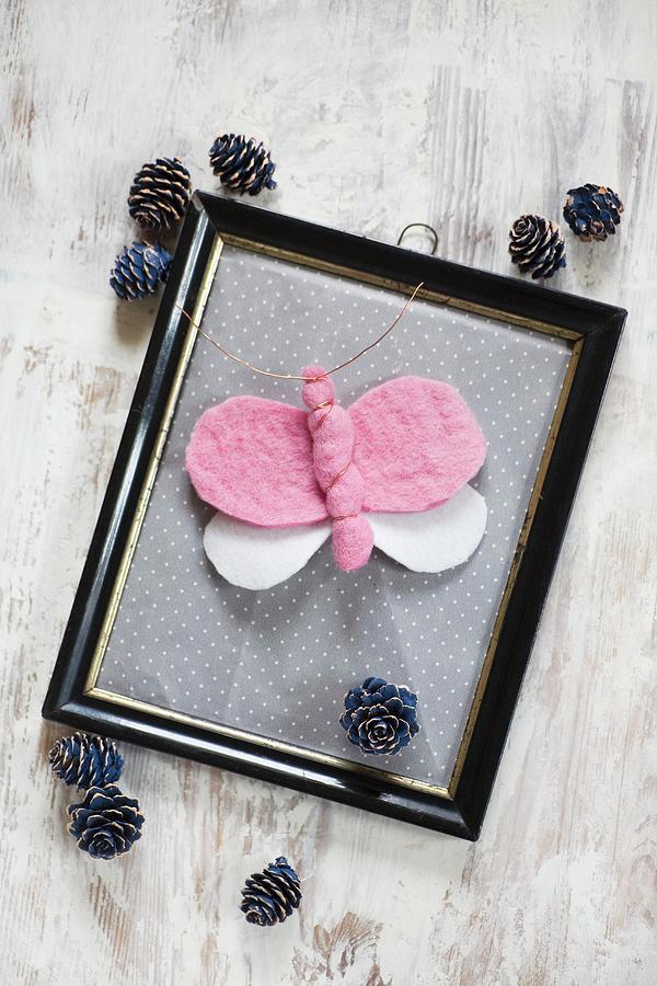 Hand-made Felt Butterfly In Vintage Picture Frame Surrounded By Pine Cones Photograph by Alicja Koll