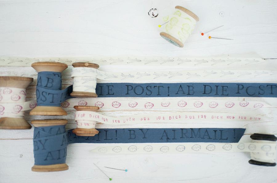 Hand-printed, Blue And White Fabric Ribbons Wound On Vintage Wooden Reels Photograph by Studio27neun