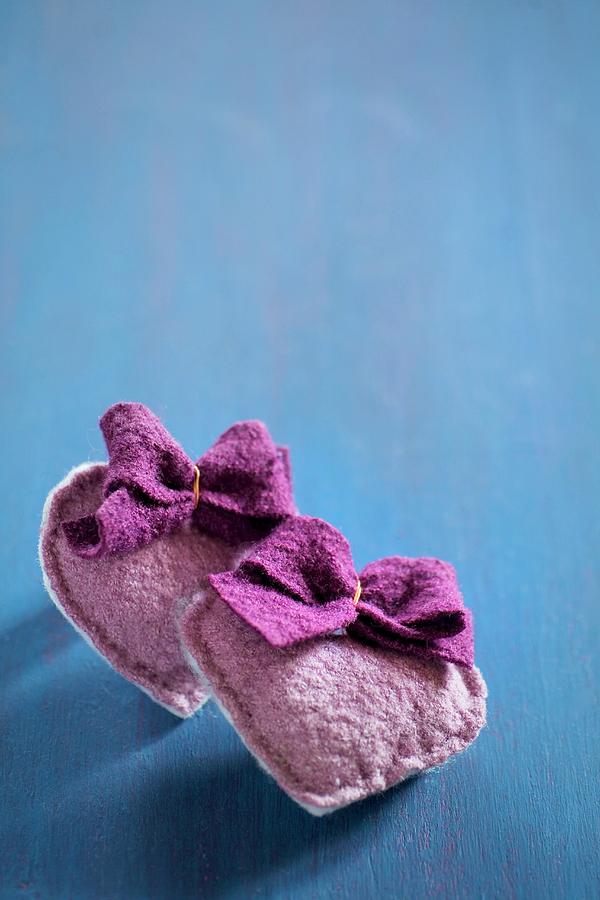 Hand-sewn Felt Hearts With Bows On Blue Surface Photograph by Alicja Koll