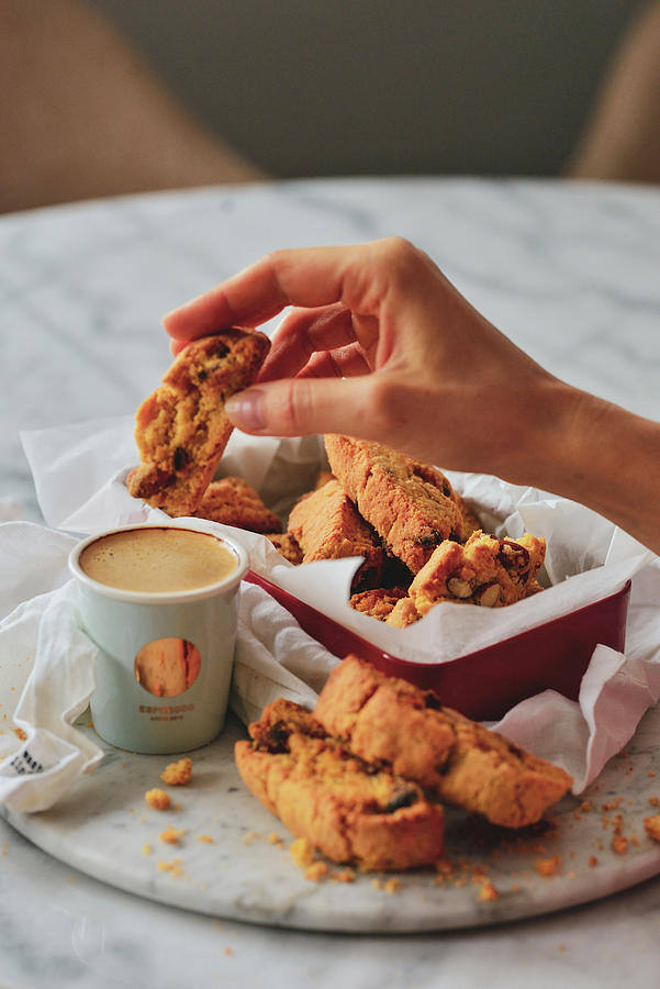 Hand With A Cookie And A Cup Of Coffee Photograph by Karolina Smyk