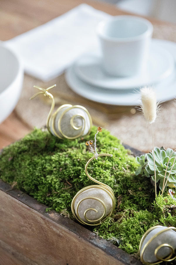 Handmade Table Centrepiece With Snails Made From Pebbles And Wire Photograph by Astrid Algermissen