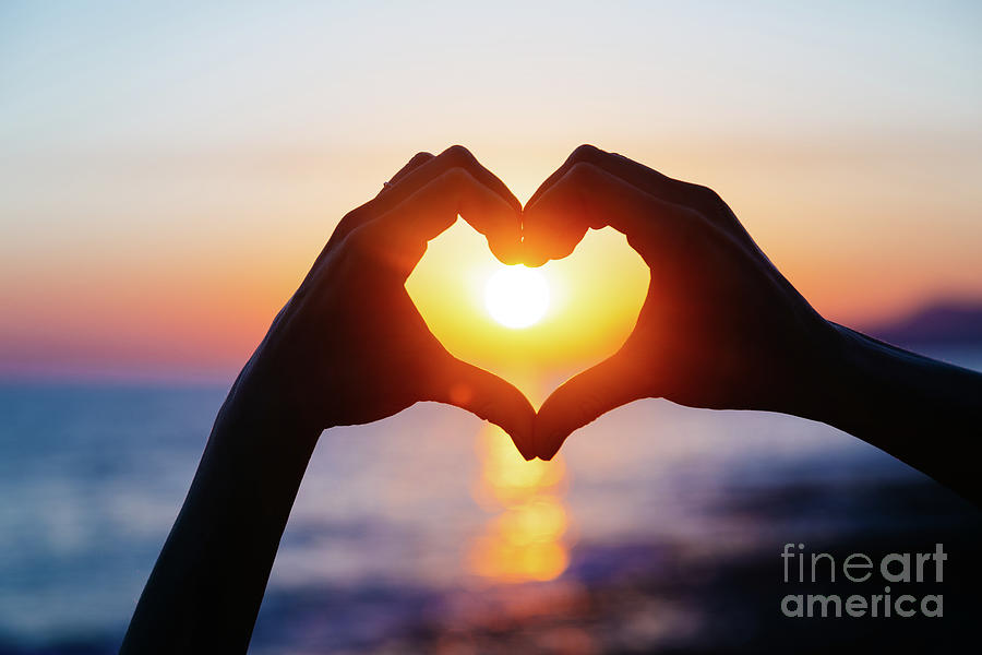 Hands Forming A Heart Shape With Sunset Photograph By Teraphim Fine Art America