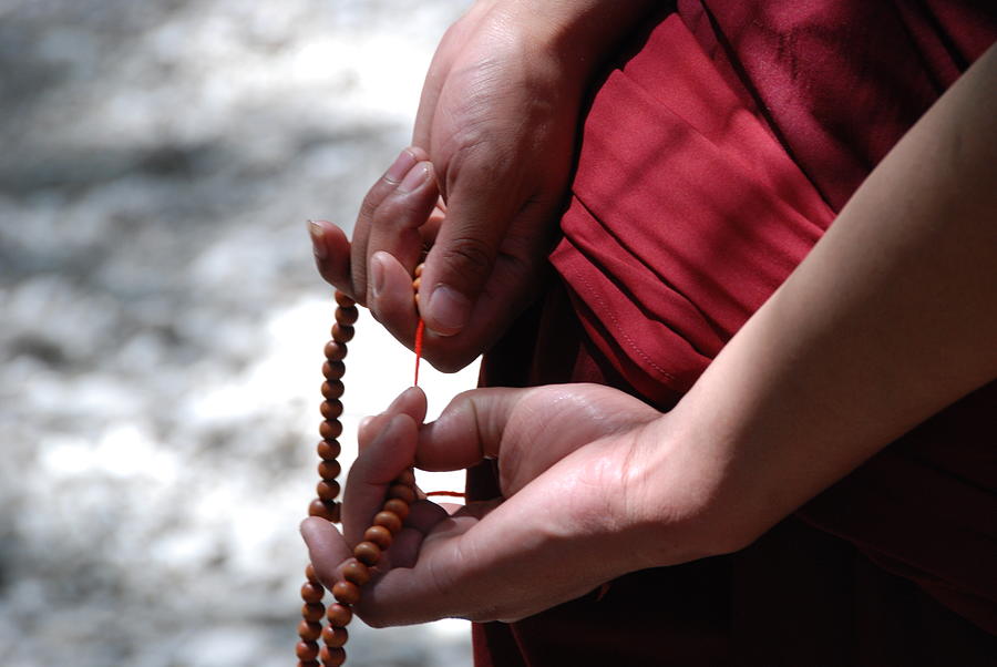 Hands Of A Tibetan Buddhist Monk Photograph by Volanthevist