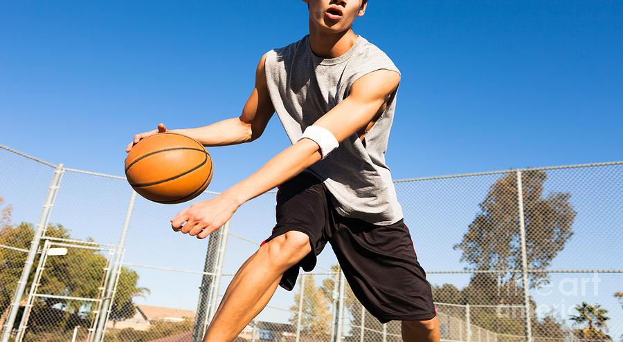 College Photograph - Handsome Male Playing Basketball Outdoor by Pkpix