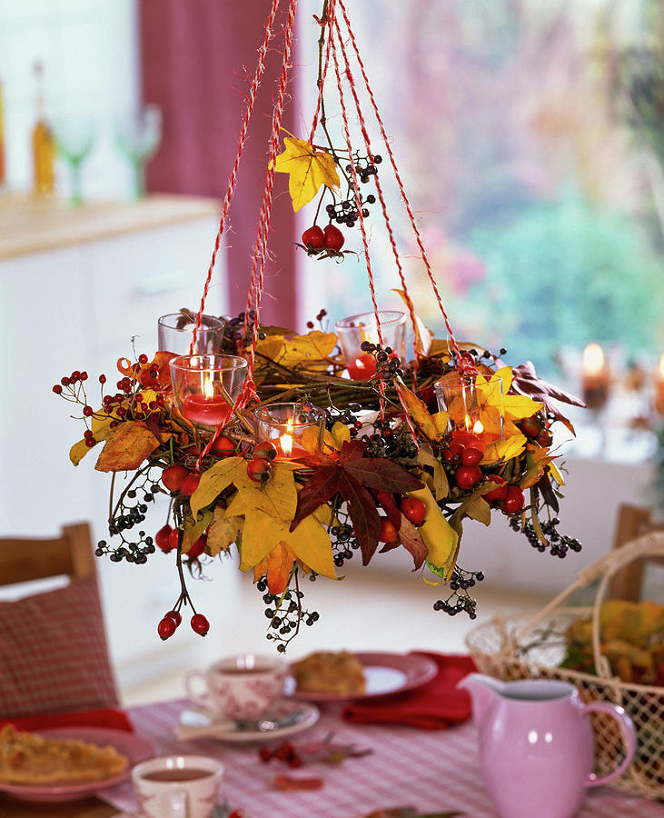 Hanging Wreath With Autumn Leaves Of Liquidambar, Rosehips And Berries Photograph by Friedrich Strauss